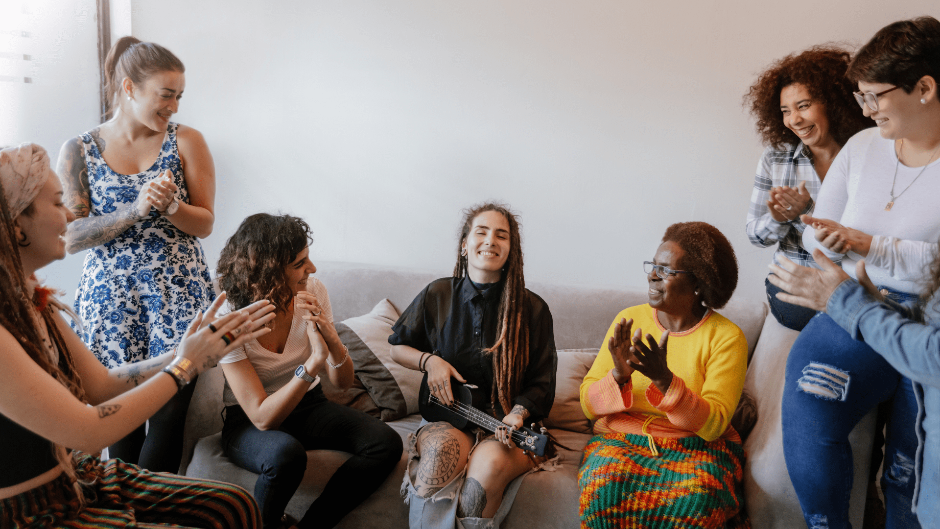 Women gathering around while listening to music.